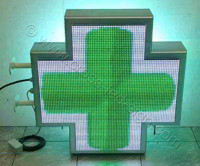 Σταυρός φαρμακείου LED RGB 70 cm με εφέ 3d πράσινο κινούμενο σταυρό περί τον άξονα του και λευκό φόντο.