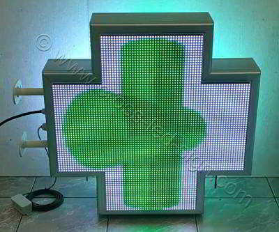Σταυρός φαρμακείου LED RGB 70 cm με εφέ 3d πράσινο κινούμενο κυλινδρικό σταυρό περί τον άξονα του και λευκό φόντο.